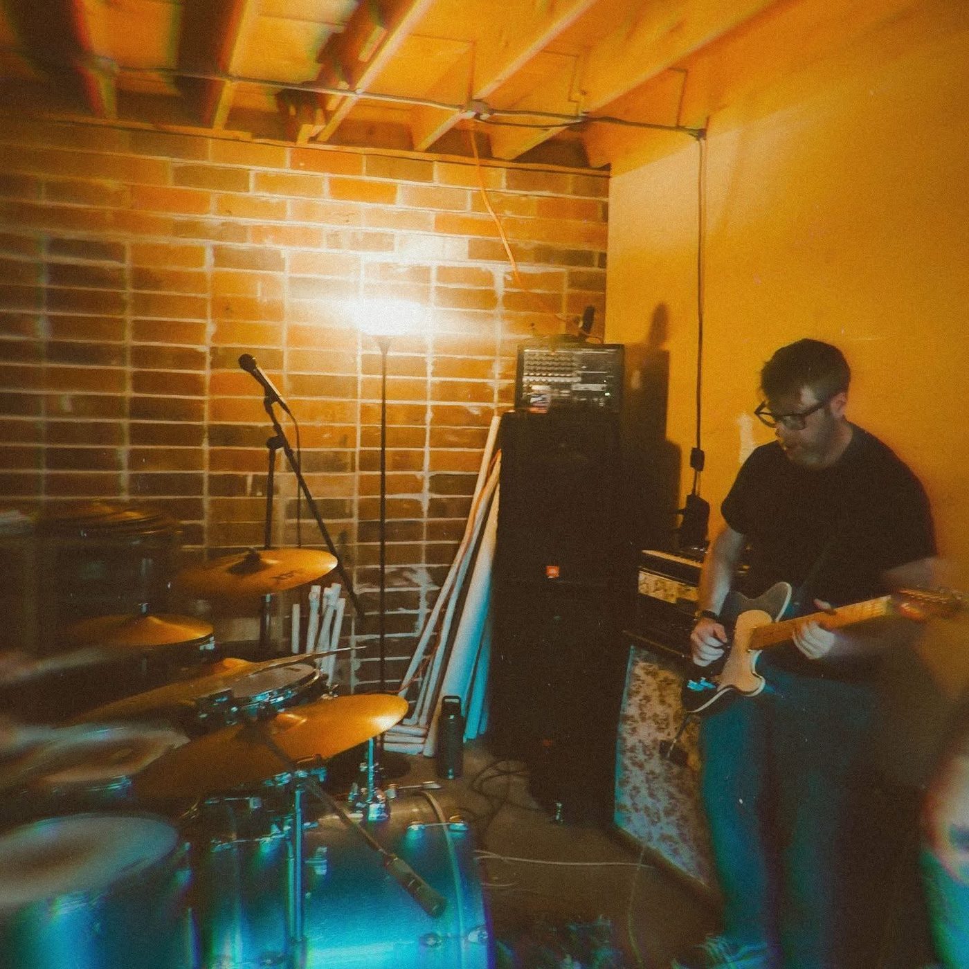 Anthony Cline playing guitar at band practice